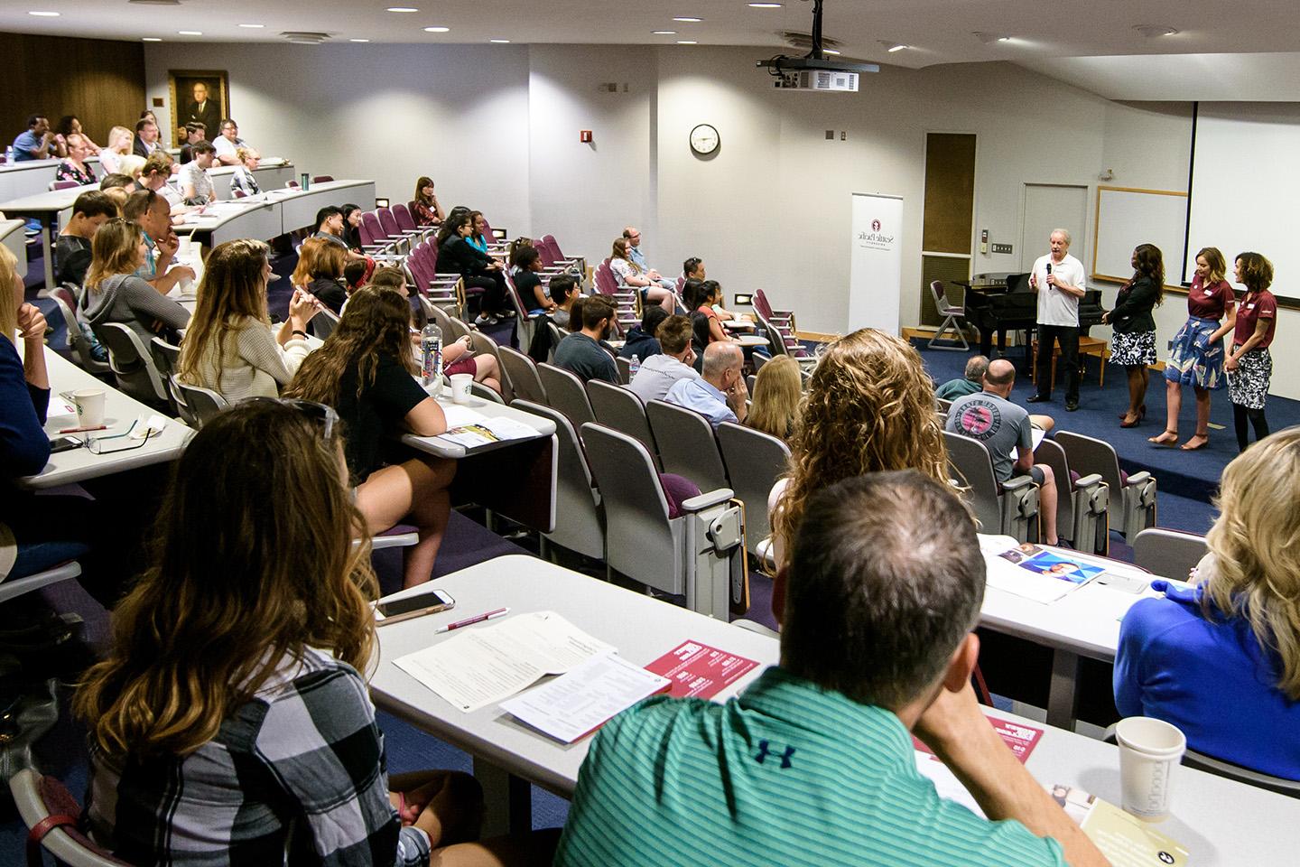 Conference attendees at a presentation in Demaray Hall