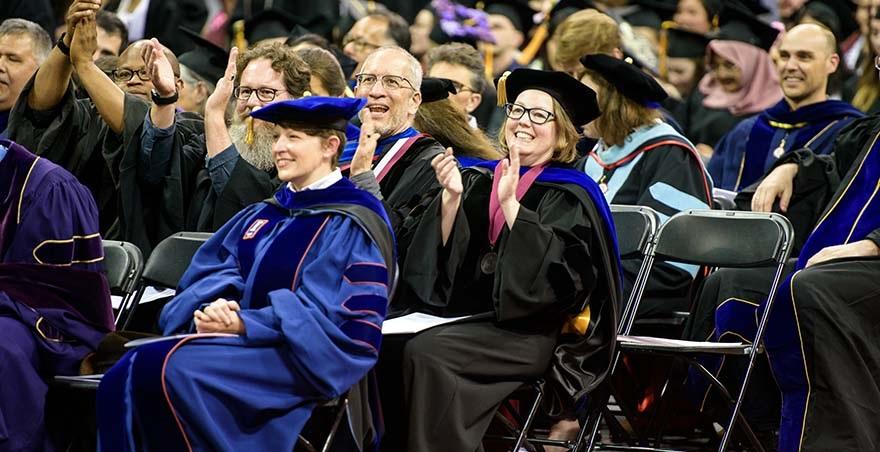 SPU faculty members applaud at the Undergraduate Commencement Ceremony.